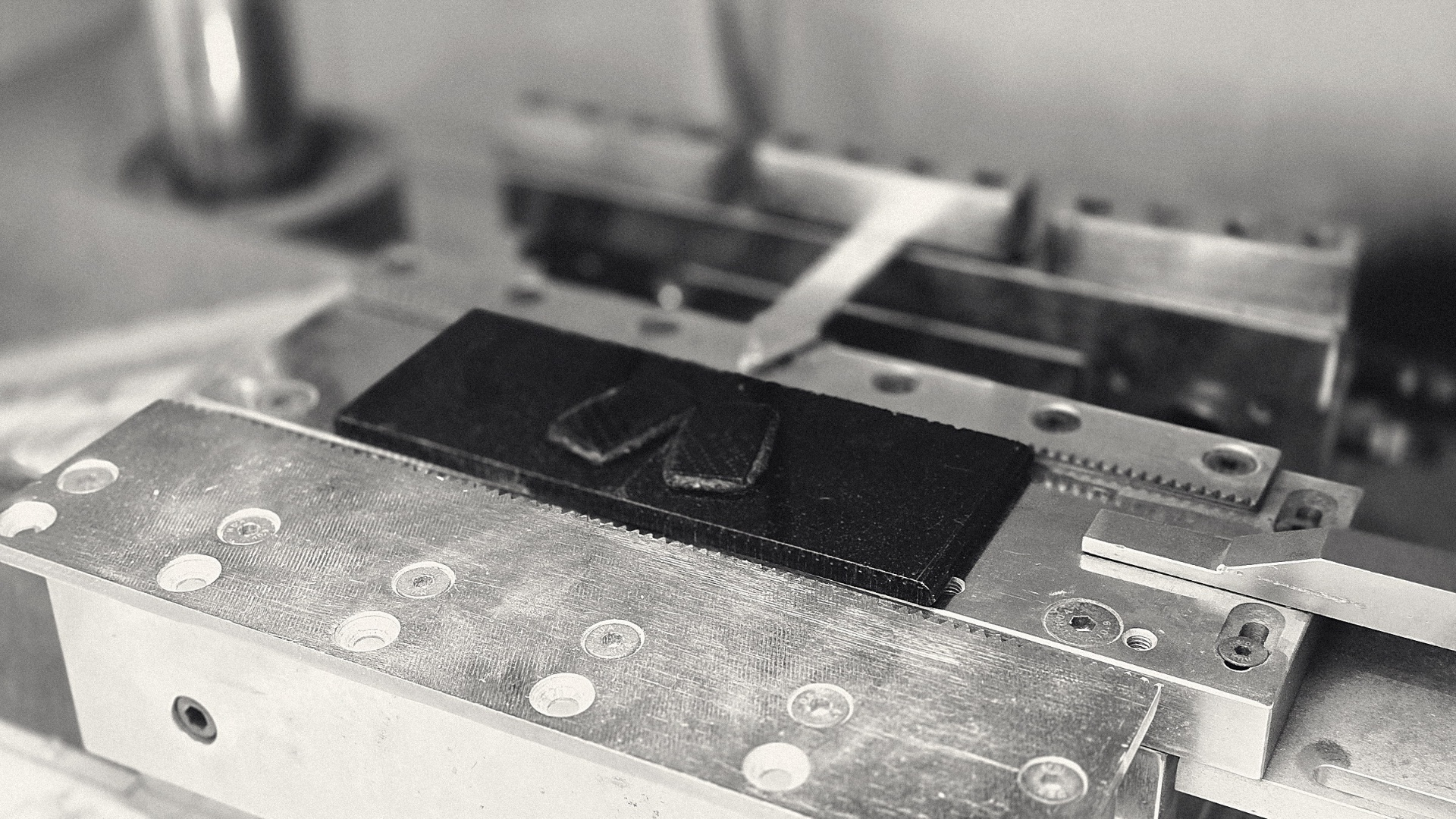 An acetate blank being profiled on the CNC bench